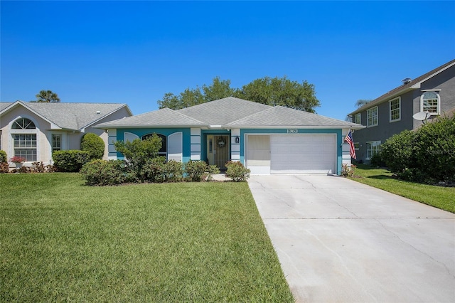 single story home with a garage, driveway, a front yard, and stucco siding