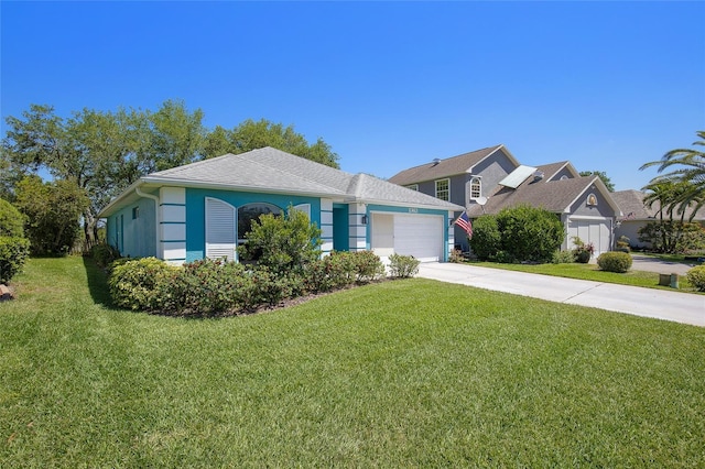view of front of home with stucco siding, driveway, a front yard, and a garage