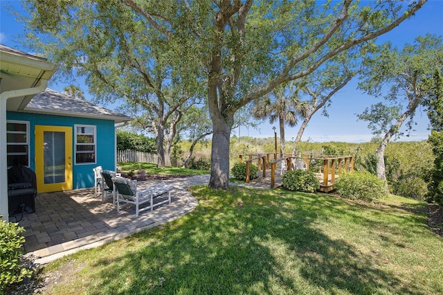 view of yard featuring a patio area and fence