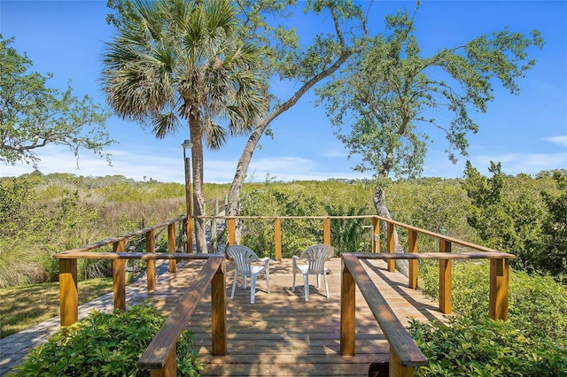 deck featuring a wooded view