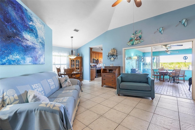 living room with visible vents, a ceiling fan, high vaulted ceiling, and light tile patterned floors