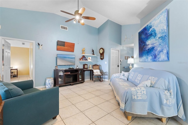 living area featuring high vaulted ceiling, light tile patterned floors, ceiling fan, baseboards, and visible vents
