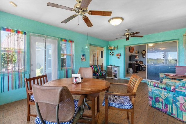 dining area with a ceiling fan