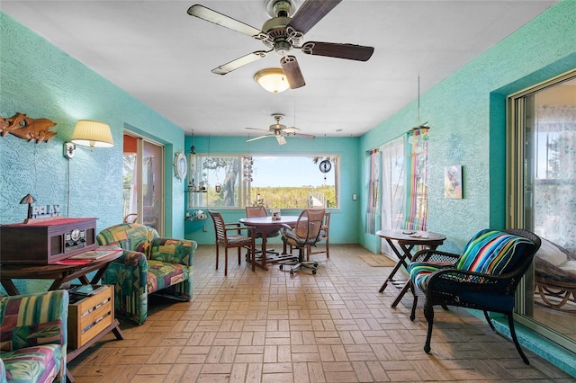 dining area featuring a ceiling fan