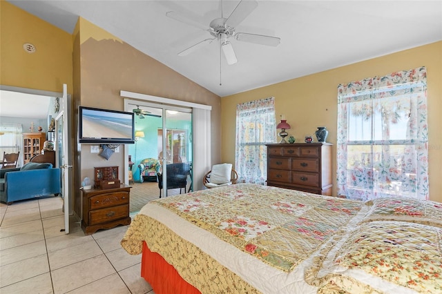 bedroom with lofted ceiling, multiple windows, and light tile patterned floors