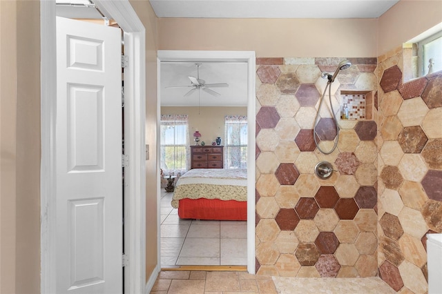 full bathroom with tile patterned flooring, ensuite bath, a ceiling fan, and tiled shower