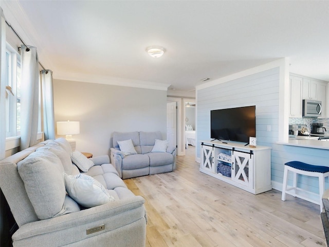 16 Hillside Dr, New Smyrna Beach, FL 32169 - living area with light wood-style floors and ornamental molding