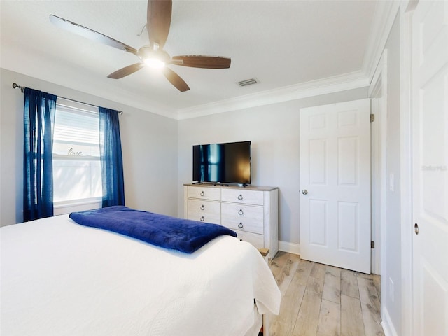16 Hillside Dr, New Smyrna Beach, FL 32169 - bedroom featuring visible vents, baseboards, a ceiling fan, light wood-style floors, and crown molding