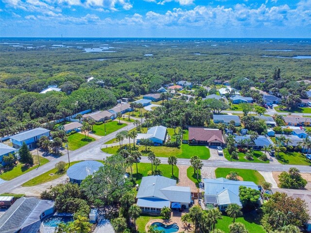 16 Hillside Dr, New Smyrna Beach, FL 32169 - drone / aerial view featuring a wooded view and a residential view