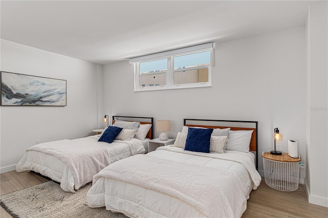 705 N Atlantic Ave Unit 4030, New Smyrna Beach, FL 32169 - bedroom with baseboards and wood finished floors