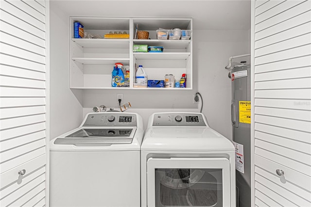 705 N Atlantic Ave Unit 4030, New Smyrna Beach, FL 32169 - laundry room featuring washer and dryer, laundry area, and electric water heater