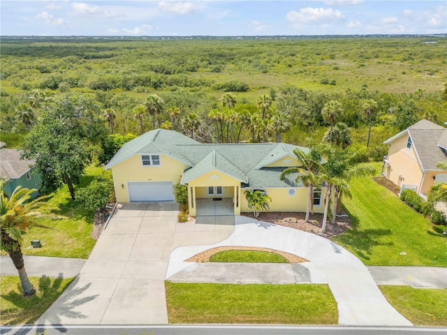 aerial view featuring a wooded view