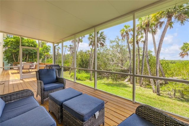 sunroom with outdoor dining area