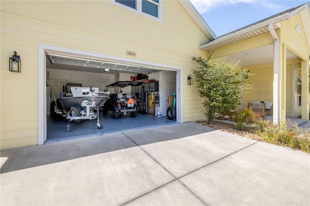 garage with concrete driveway