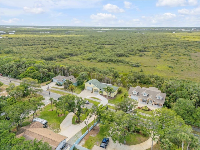 birds eye view of property with a forest view