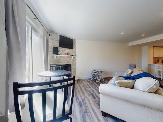 4752 S Atlantic Ave Unit 1, Ponce Inlet, FL 32127 - living room with wood finished floors, a fireplace, baseboards, and recessed lighting