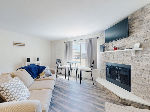 4752 S Atlantic Ave Unit 1, Ponce Inlet, FL 32127 - living room featuring wood finished floors and a fireplace