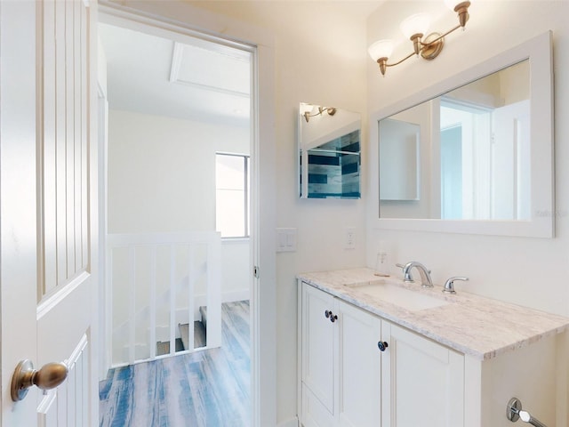 4752 S Atlantic Ave Unit 1, Ponce Inlet, FL 32127 - bathroom featuring vanity and wood finished floors