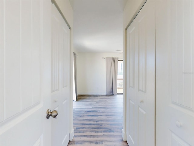 4752 S Atlantic Ave Unit 1, Ponce Inlet, FL 32127 - hall featuring wood finished floors and baseboards