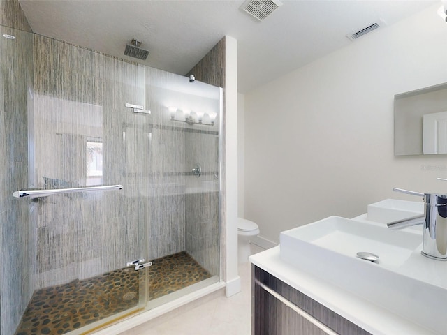 4752 S Atlantic Ave Unit 1, Ponce Inlet, FL 32127 - bathroom featuring a shower stall, vanity, toilet, and tile patterned floors