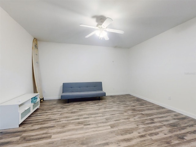4752 S Atlantic Ave Unit 1, Ponce Inlet, FL 32127 - unfurnished room featuring wood finished floors, ceiling fan, and baseboards
