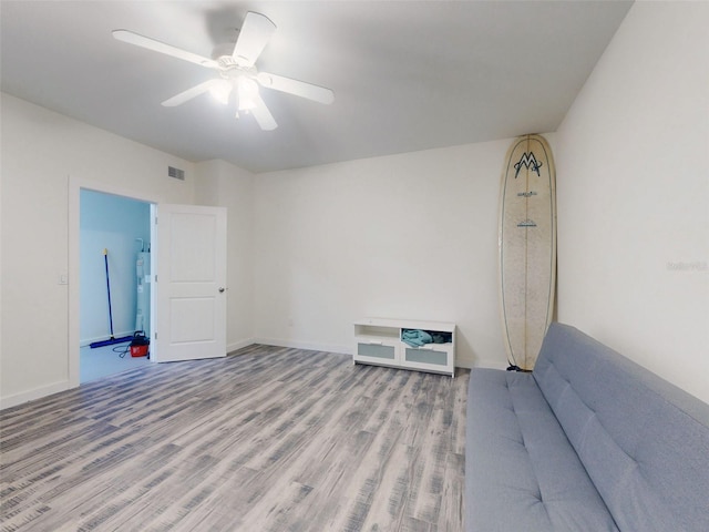 4752 S Atlantic Ave Unit 1, Ponce Inlet, FL 32127 - unfurnished room with wood finished floors, a ceiling fan, and baseboards