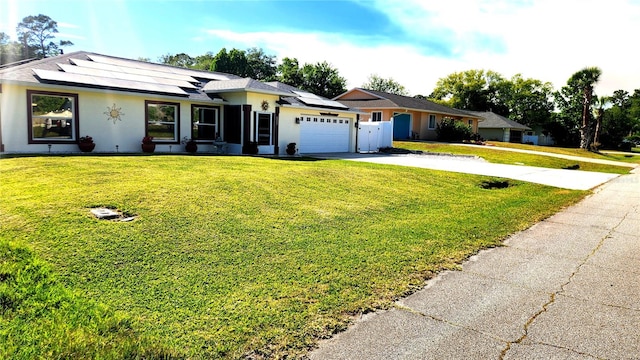 ranch-style home with concrete driveway, a front yard, stucco siding, and an attached garage