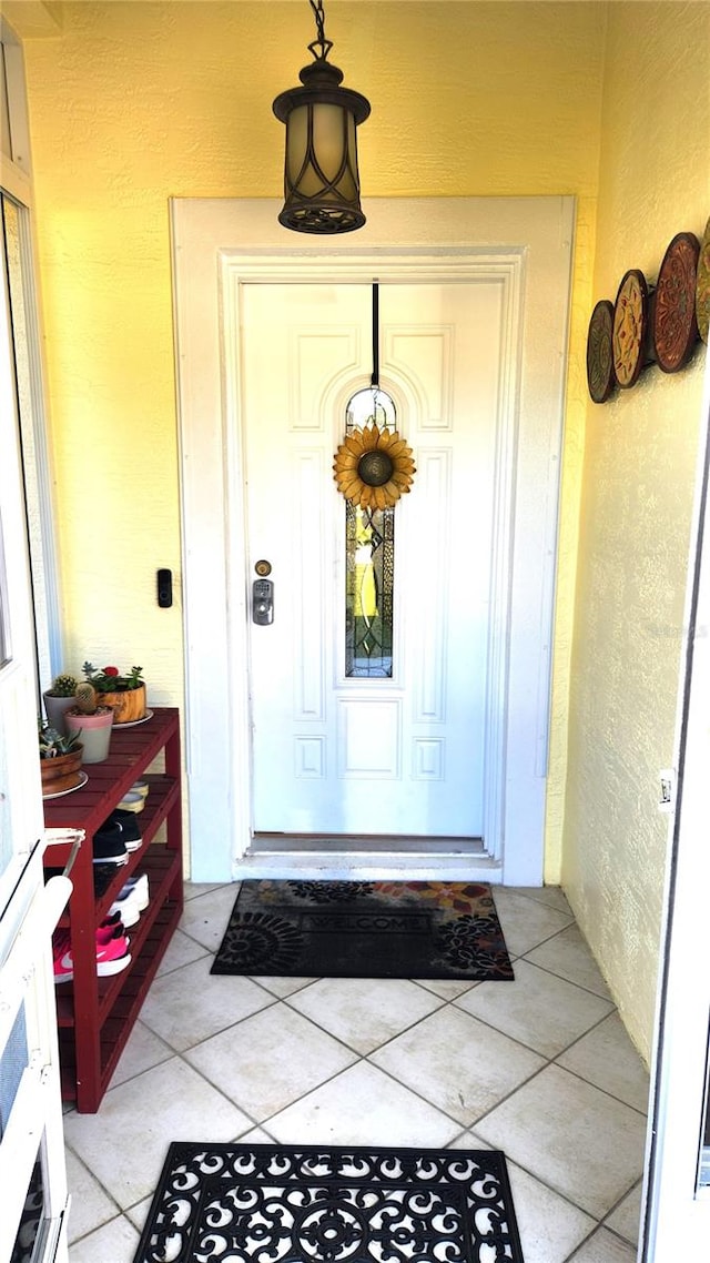 property entrance with stucco siding