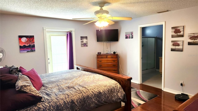 bedroom with visible vents, baseboards, ceiling fan, a textured ceiling, and wood finished floors