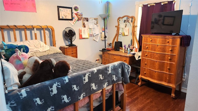 bedroom featuring wood finished floors