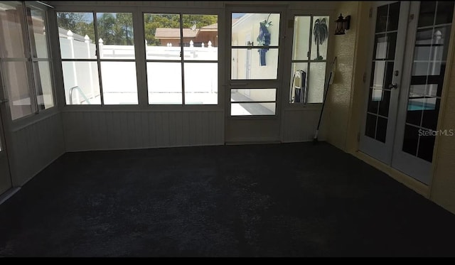 unfurnished sunroom featuring french doors