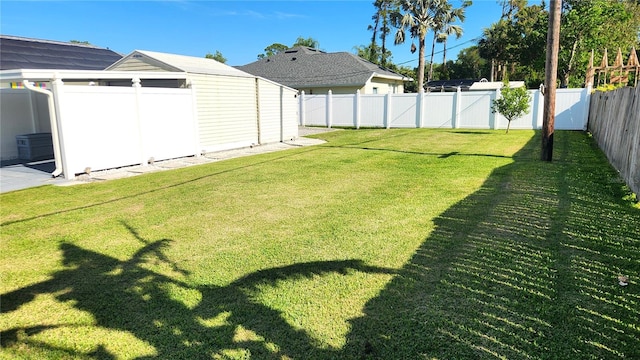 view of yard with a fenced backyard
