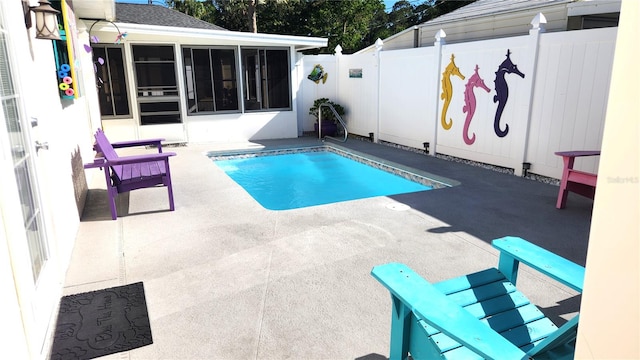view of pool featuring a patio area, a fenced backyard, a fenced in pool, and a sunroom