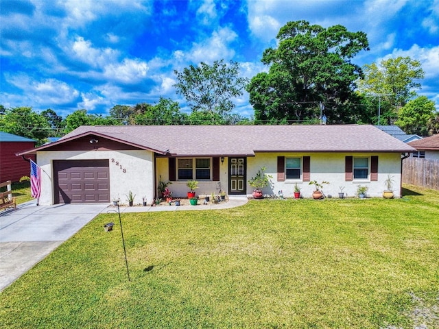 2218 Orange Tree Dr, Edgewater, FL 32141 - ranch-style house with an attached garage, a front lawn, stucco siding, and driveway