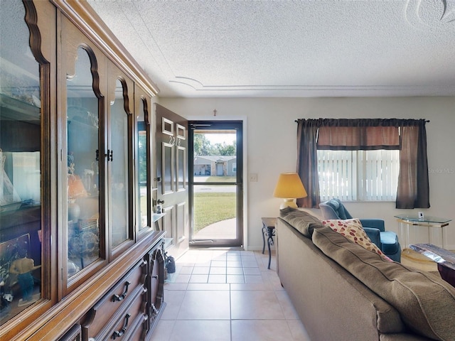 2218 Orange Tree Dr, Edgewater, FL 32141 - living room with a textured ceiling and light tile patterned floors