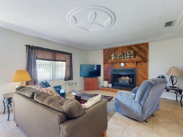 2218 Orange Tree Dr, Edgewater, FL 32141 - living area with light tile patterned flooring, a textured ceiling, visible vents, and a large fireplace
