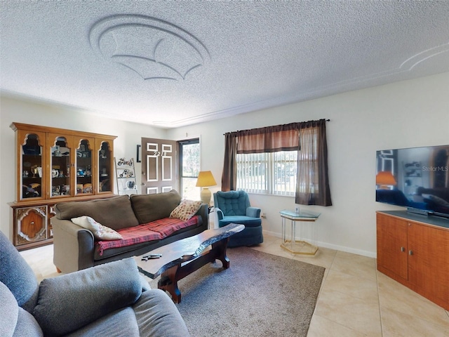 2218 Orange Tree Dr, Edgewater, FL 32141 - living area featuring light tile patterned flooring and a textured ceiling