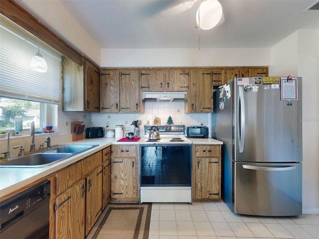2218 Orange Tree Dr, Edgewater, FL 32141 - kitchen featuring a sink, freestanding refrigerator, dishwasher, under cabinet range hood, and white range with electric cooktop