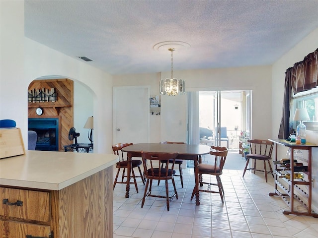2218 Orange Tree Dr, Edgewater, FL 32141 - dining room featuring visible vents, arched walkways, a textured ceiling, and light tile patterned floors