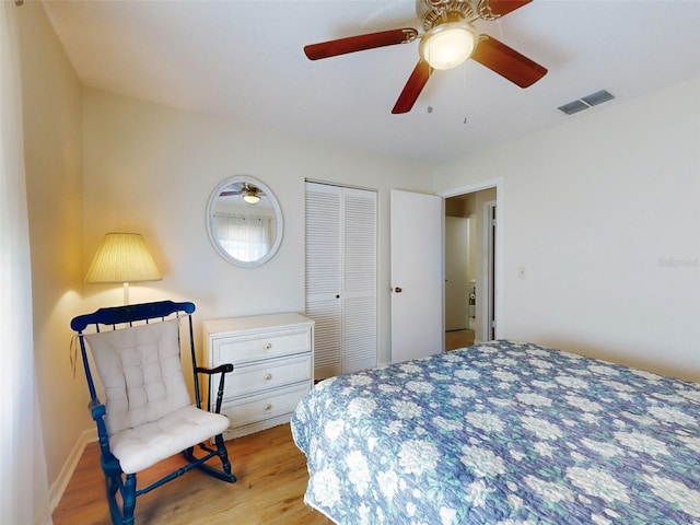2218 Orange Tree Dr, Edgewater, FL 32141 - bedroom featuring wood finished floors, visible vents, a closet, and a ceiling fan