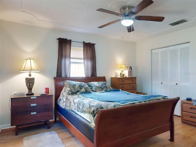 2218 Orange Tree Dr, Edgewater, FL 32141 - bedroom with a closet, wood finished floors, visible vents, and a ceiling fan