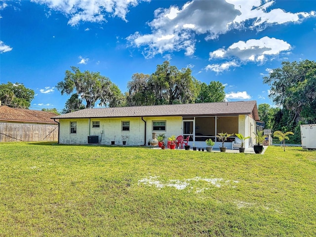 2218 Orange Tree Dr, Edgewater, FL 32141 - rear view of house with a yard, central AC unit, and fence