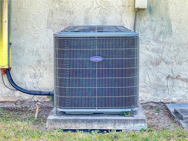 2218 Orange Tree Dr, Edgewater, FL 32141 - details with central air condition unit and stucco siding