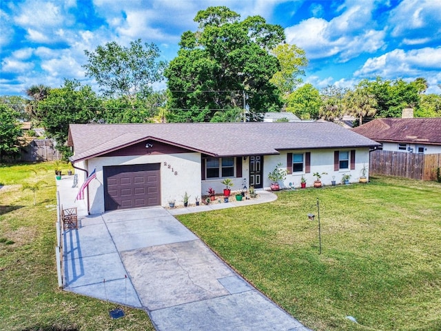 2218 Orange Tree Dr, Edgewater, FL 32141 - single story home featuring fence, a shingled roof, a front lawn, driveway, and a garage