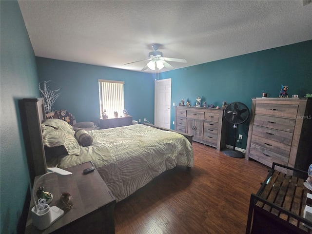 2530 Tamarind Dr, Edgewater, FL 32141 - bedroom featuring dark wood-style flooring, ceiling fan, a textured ceiling, and baseboards