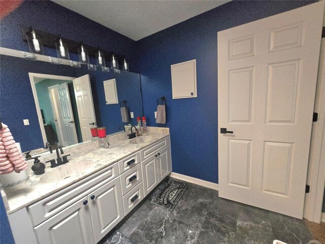 2530 Tamarind Dr, Edgewater, FL 32141 - full bath with double vanity and baseboards
