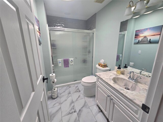 2530 Tamarind Dr, Edgewater, FL 32141 - full bath featuring toilet, marble look tiles, a stall shower, and vanity