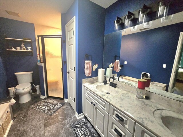 2530 Tamarind Dr, Edgewater, FL 32141 - bathroom with double vanity, toilet, baseboards, and marble finish floors
