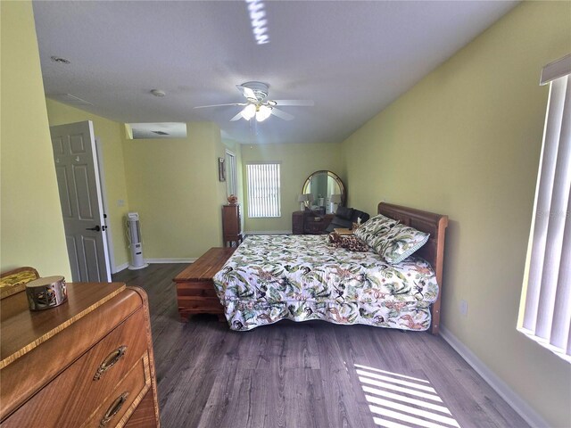 2530 Tamarind Dr, Edgewater, FL 32141 - bedroom with dark wood-style flooring, baseboards, and ceiling fan