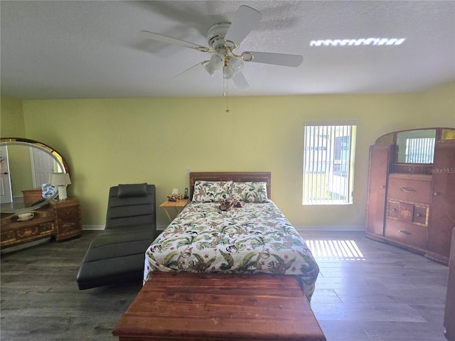 2530 Tamarind Dr, Edgewater, FL 32141 - bedroom featuring baseboards, wood finished floors, and a ceiling fan